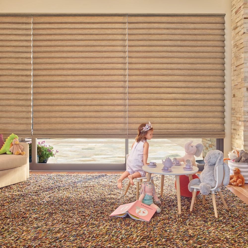 child playing in room with roman shades